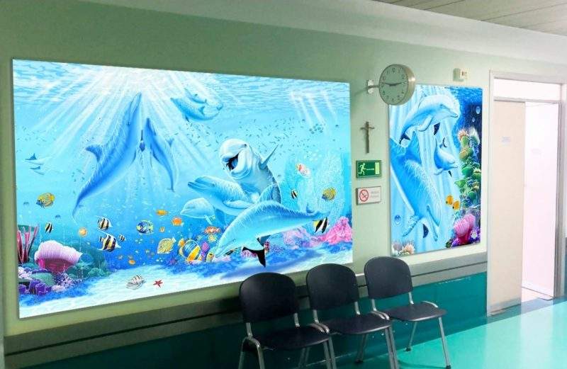 صور رائعة.. كيف حول فنان إيطالي مستشفى كئيبة إلى جنة للأطفال؟
